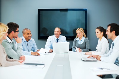 Employees Sitting around a conference table