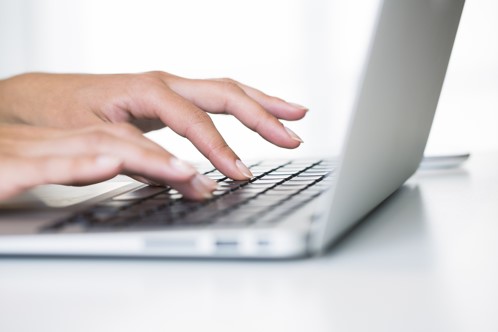 image of lady working on laptop