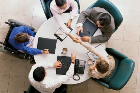 image of agents sitting at meeting table