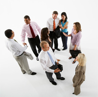 image of business group standing around talking
