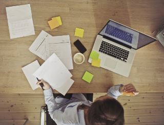 woman sitting at desk working